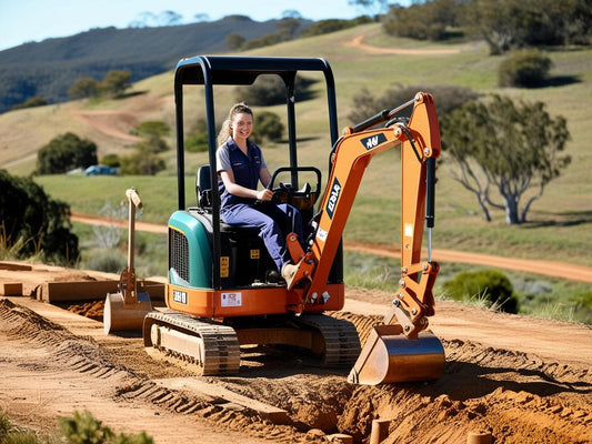 A woman operating a mini excavator on a dirt road in a rural landscape, showcasing its practical use