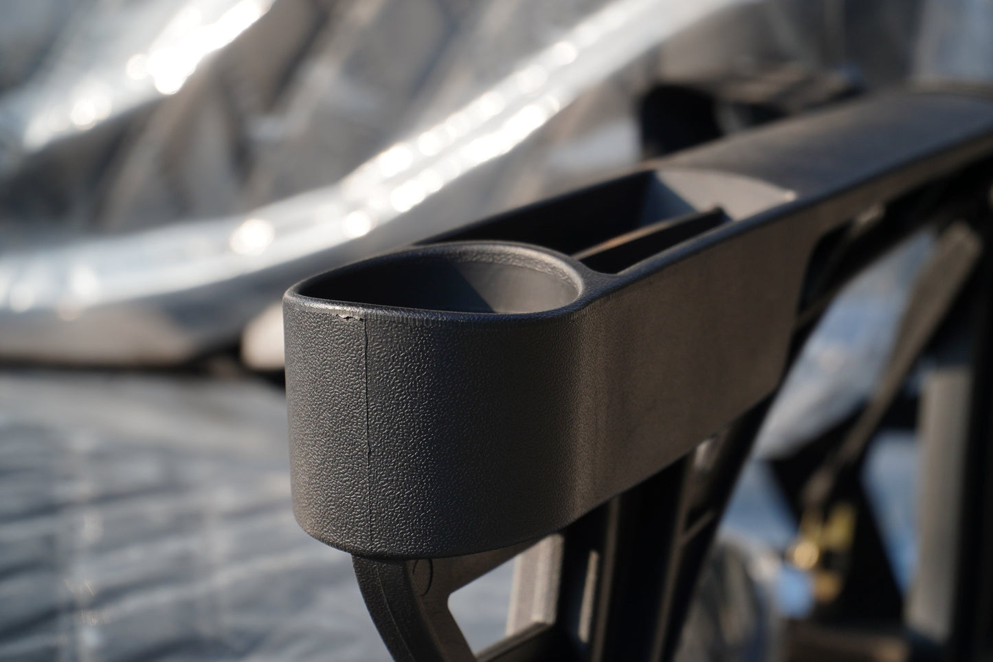 Close-up of a Golf Cart cup holder showing durable material and design details
