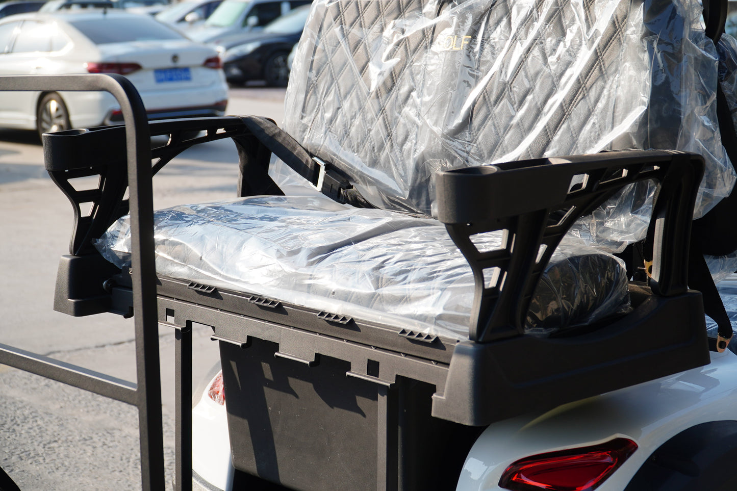 Comfortable seat on Labadi Engineering Golf Cart with protective plastic cover