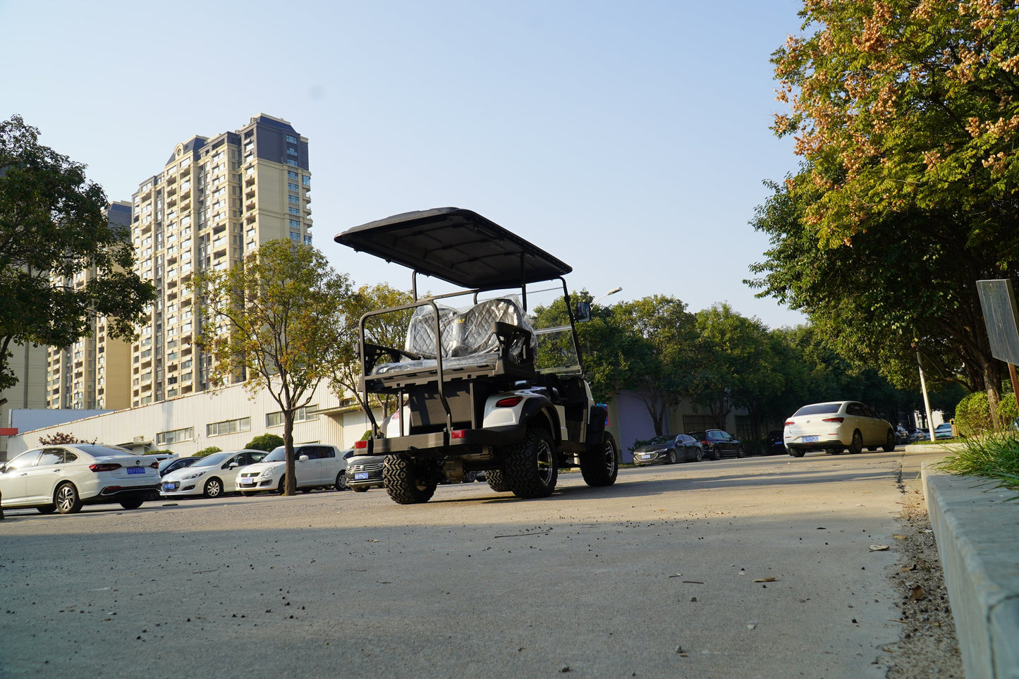 Labadi Engineering Golf Cart on a city street with tall buildings in the background