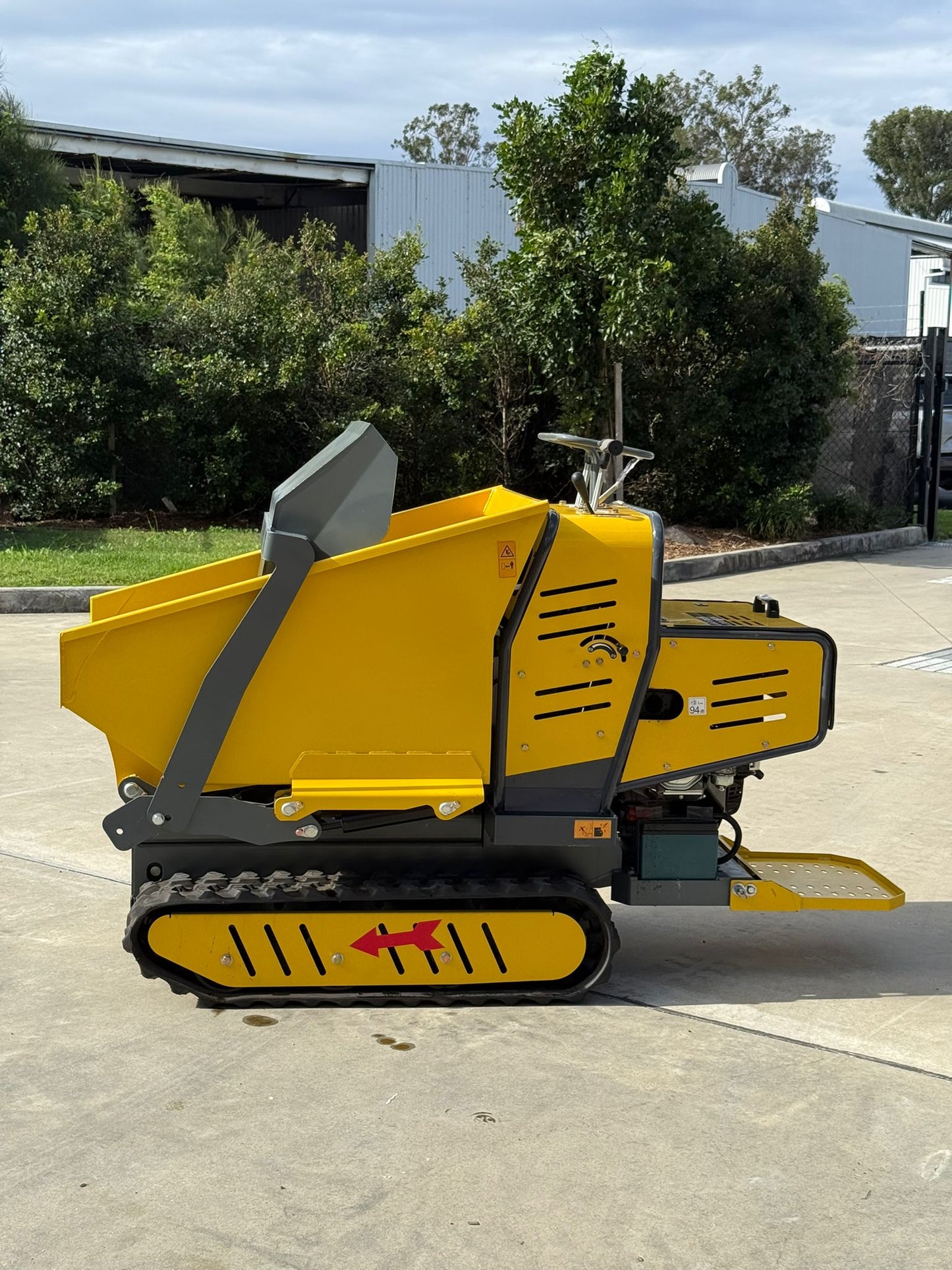 Labadi Engineering compact excavator designed for lifting and transporting materials with a lift dump truck functionality