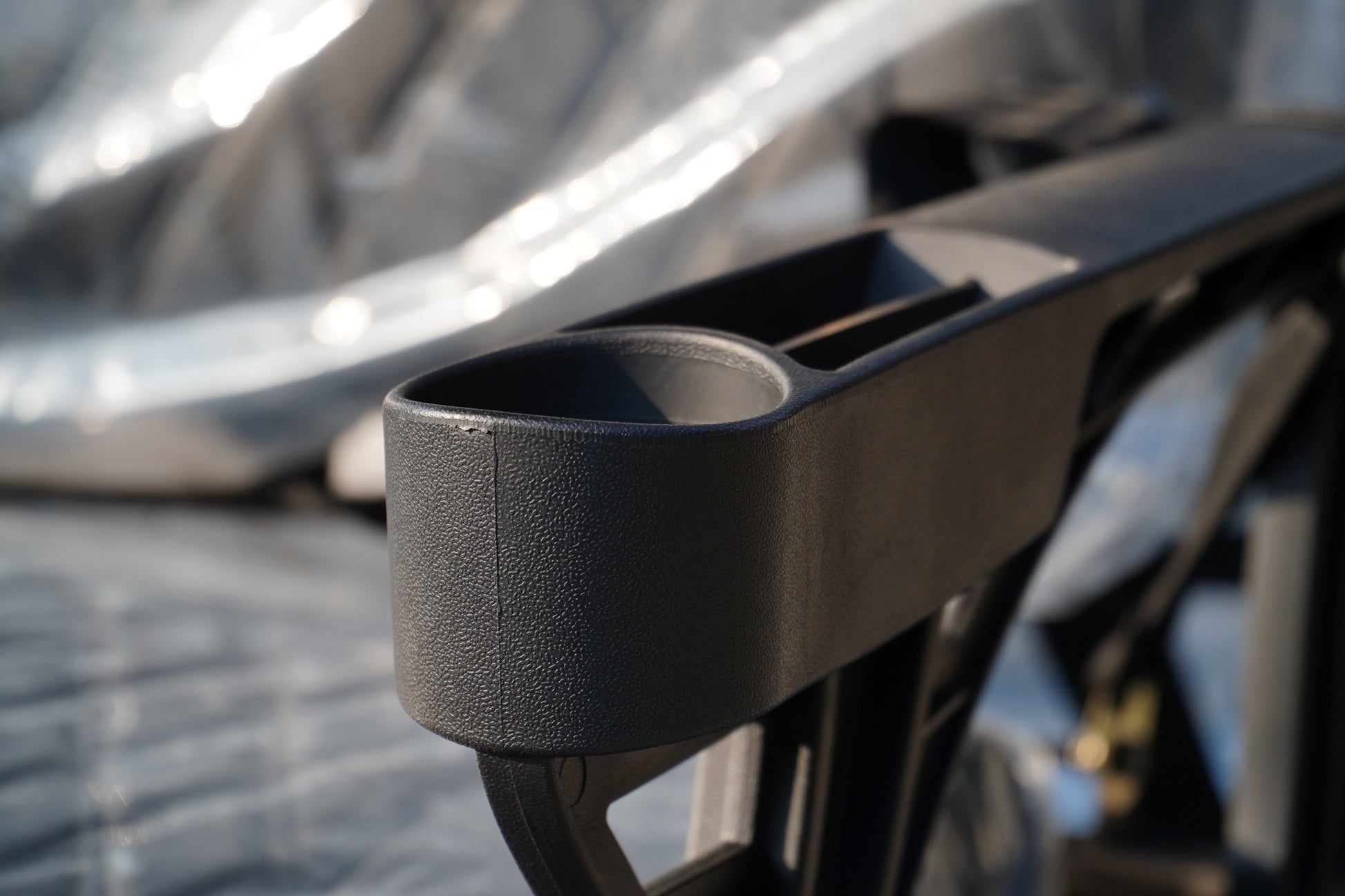 Close-up of a Golf Cart cup holder showing durable material and design details