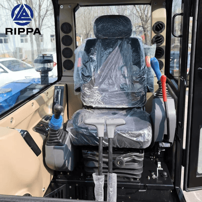 Interior view of a Labadi Engineering Mini Excavator with protective covering on the operator's seat