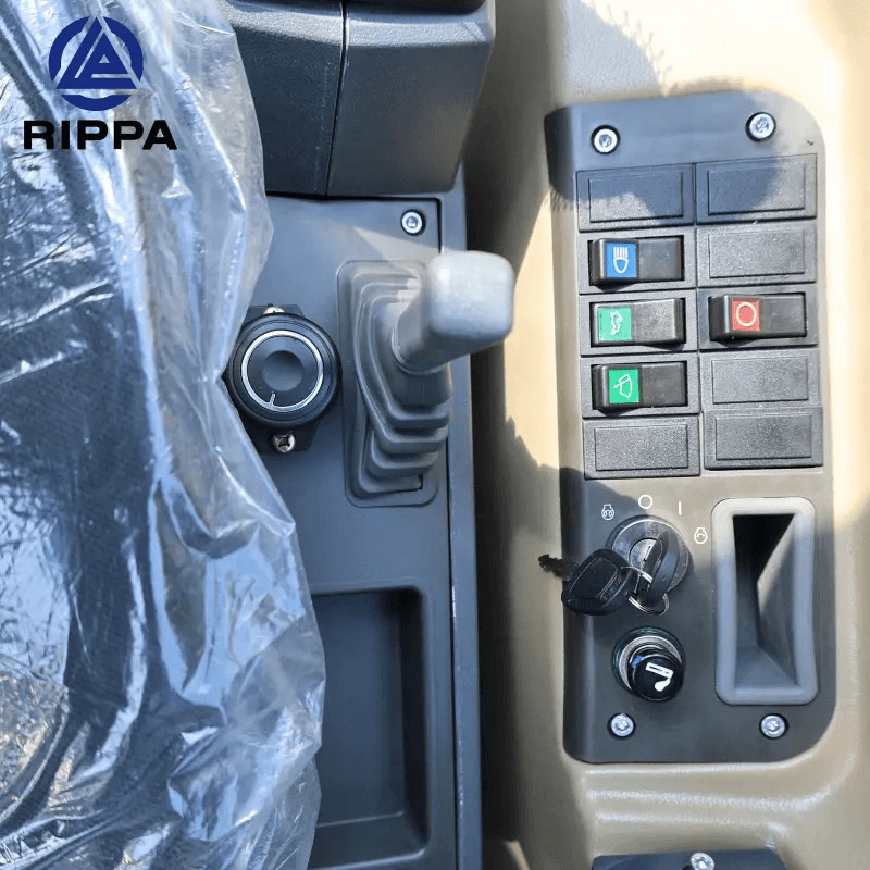 Control panel of a Labadi Engineering Mini Excavator showing joystick and function buttons