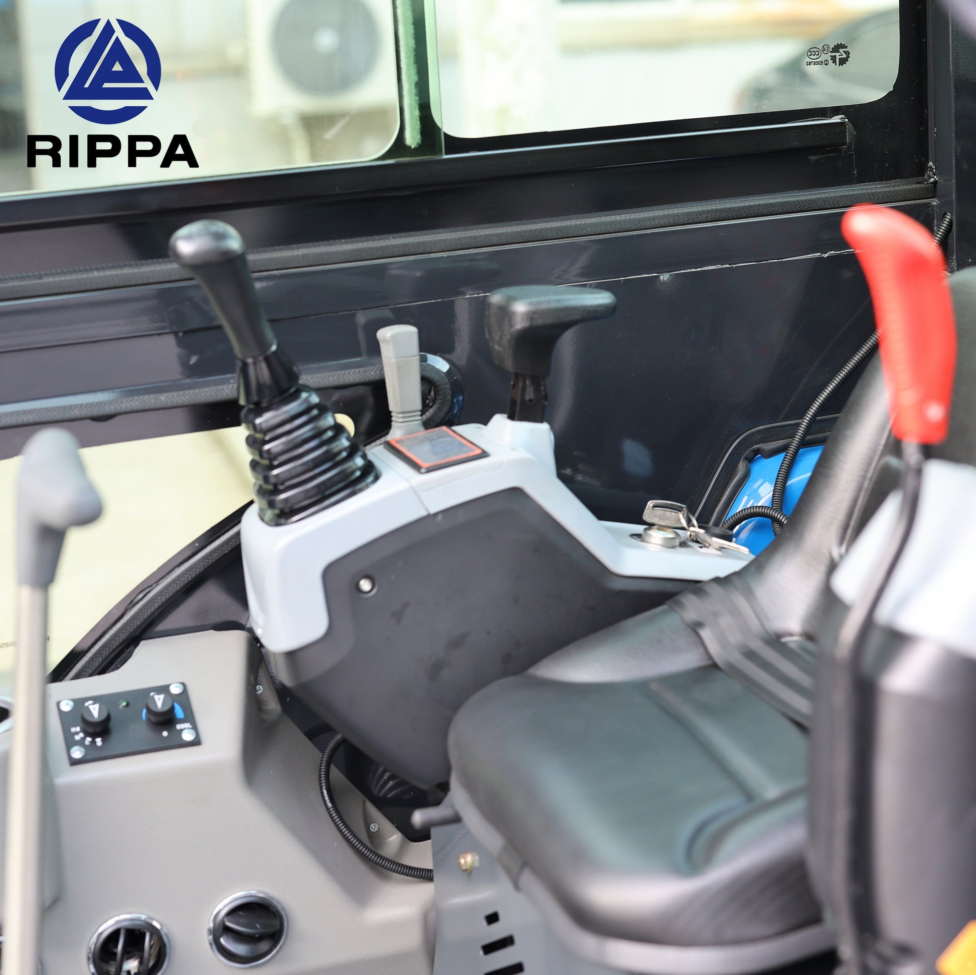 Interior view of Labadi Engineering mini excavator controls and seat with joystick operation