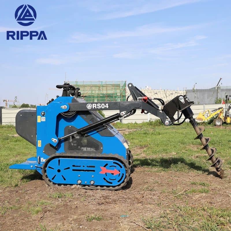 Labadi Engineering Skid Steer RS04 Compact Excavator with Auger Attachment on Green Field