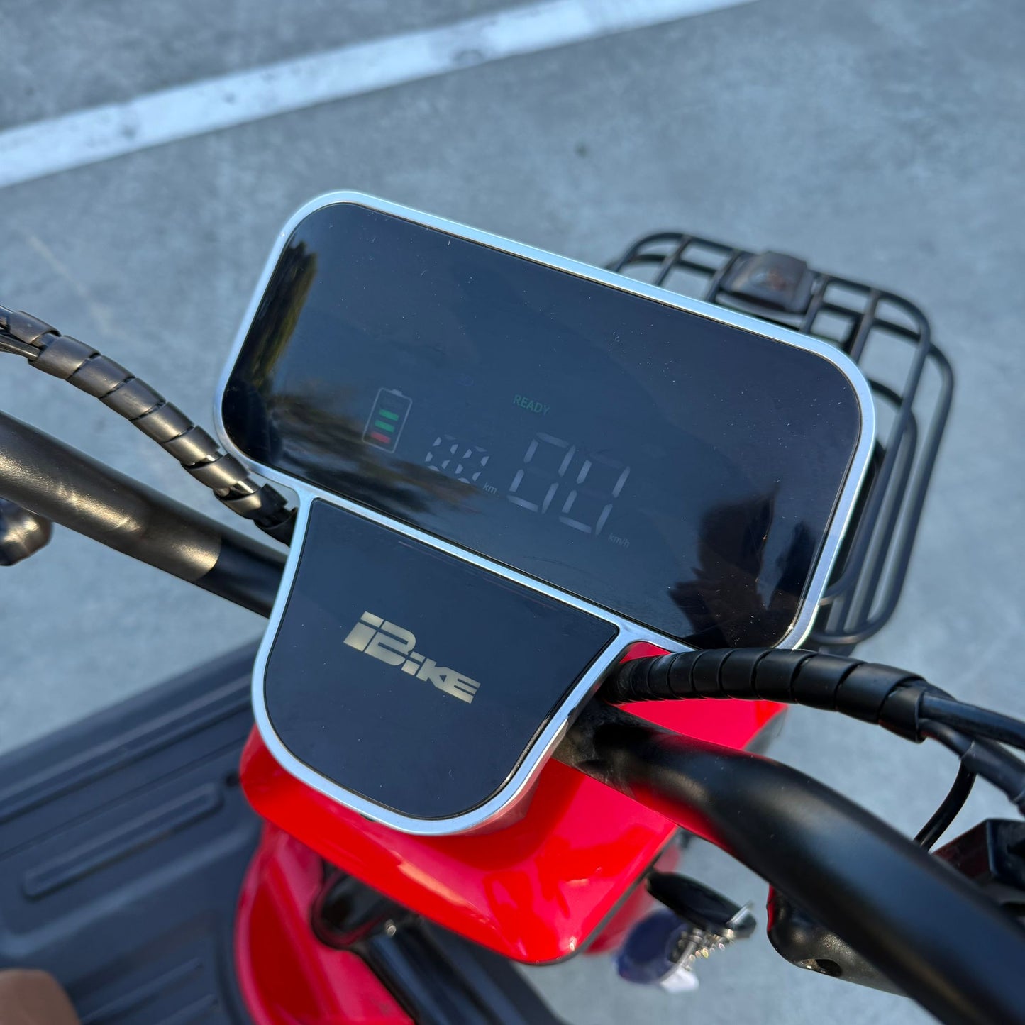 Labadi Engineering Wheel Trike digital display and handlebar controls on red frame